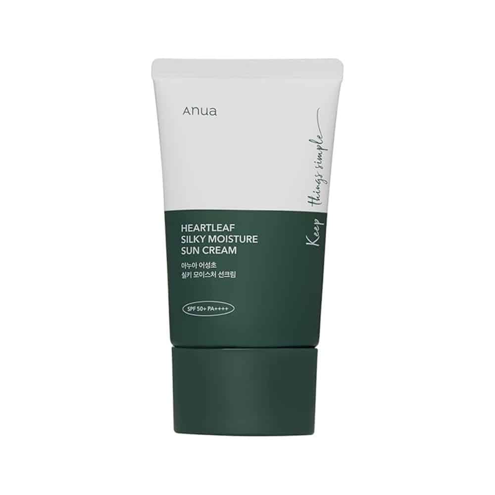 Front and side view of ANUA Heartleaf Silky Moisture Sunscreen tube (50ml) on white background. Gold text highlights "SPF 50+ PA++++" and "Heartleaf Extract." Design emphasizes clean, clinical elegance suited for sensitive skin in sunny climates.