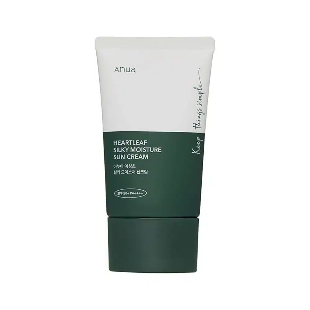 Front and side view of ANUA Heartleaf Silky Moisture Sunscreen tube (50ml) on white background. Gold text highlights "SPF 50+ PA++++" and "Heartleaf Extract." Design emphasizes clean, clinical elegance suited for sensitive skin in sunny climates.