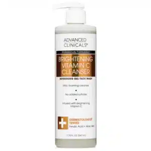 A sleek pump bottle of Advanced Clinicals Brightening Vitamin C Cleanser on a white background, featuring vibrant citrus graphics. Text highlights "Vitamin C + Ferulic Acid" and "Gentle for All Skin Types," with golden accents reflecting premium, tropical-friendly skincare.