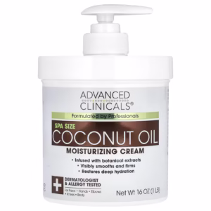 White jar of Advanced Clinicals Coconut Oil Moisturizing Cream on white background. Label highlights "Coconut Oil," "Chamomile," and "24-Hour Hydration." Cream texture shown in open jar, ideal for face, body, and hair. Perfect for dry, sensitive skin in tropical climates.
