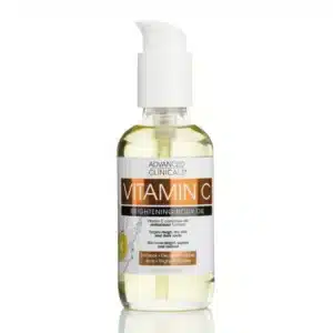 Clear glass bottle of Advanced Clinicals Vitamin C Brightening Body Oil on white background, showcasing golden-hued oil. Key ingredients—Vitamin C, Turmeric, Grapefruit—highlighted for radiant, even-toned skin. Ideal for humid climates, non-greasy hydration.