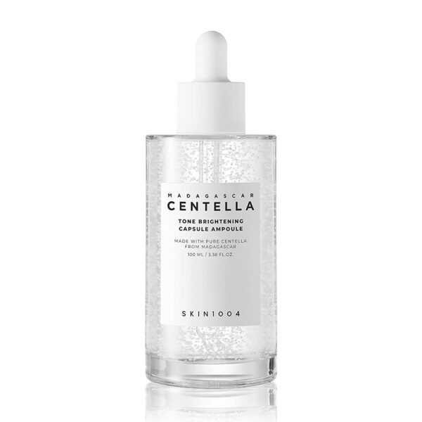 SKIN1004 Madagascar Centella Tone Brightening Capsule Ampoule 50ml—clear bottle with dropper, containing a lightweight, transparent serum with micro-beads, designed to brighten and soothe skin.