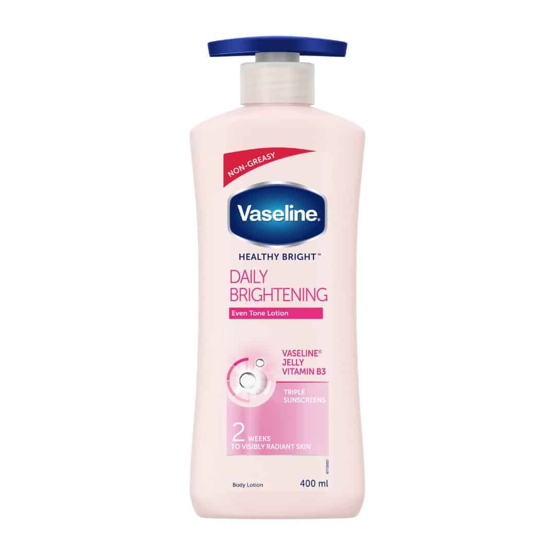 Vaseline Healthy Bright Daily Brightening Body Lotion 400 ml bottle standing on a white background, showing pink-labelled packaging that highlights Vitamin B3, Vaseline Jelly, and triple sunscreen benefits.