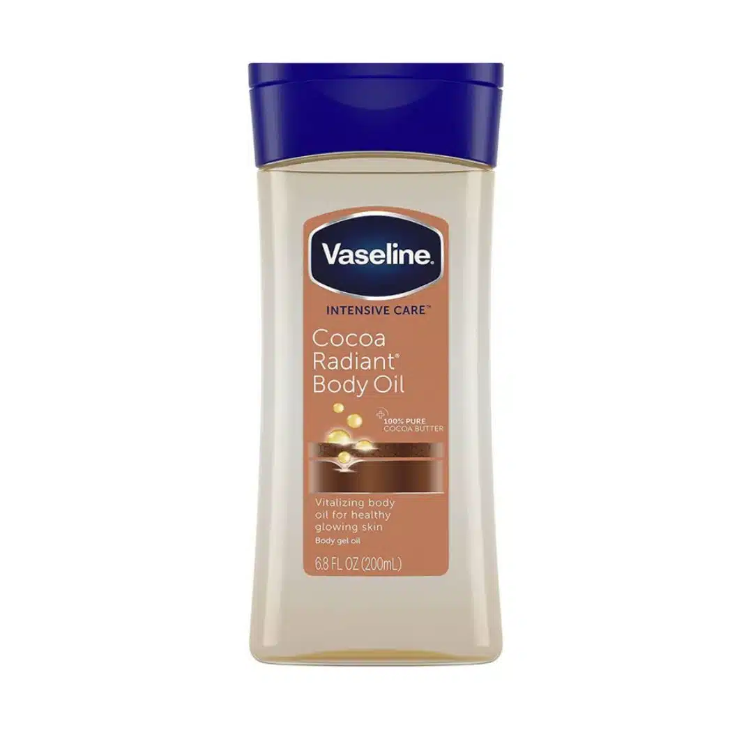 Front-facing bottle of Vaseline Intensive Care Cocoa Radiant Body Oil (200 ml) with pump dispenser on a clean white background, showing golden-brown gel oil inside the clear bottle and the cocoa-butter label for nourishing, radiant-skin benefits.