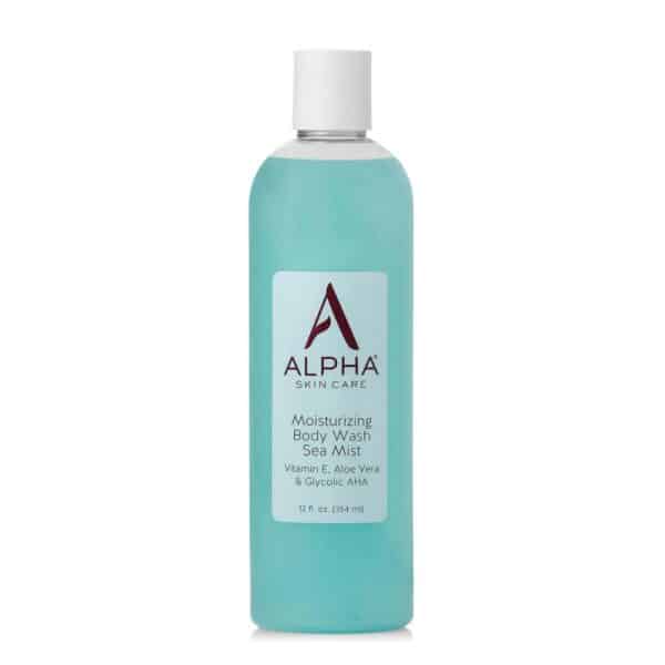 Clear white-background image of a 12 fl oz bottle labeled “Alpha Skin Care Moisturizing Body Wash – Sea Mist.” The burgundy Alpha “A” logo sits above product claims: 10 % glycolic AHA, Vitamin E & Aloe Vera. Aqua wave graphic suggests its refreshing, ocean-inspired scent.