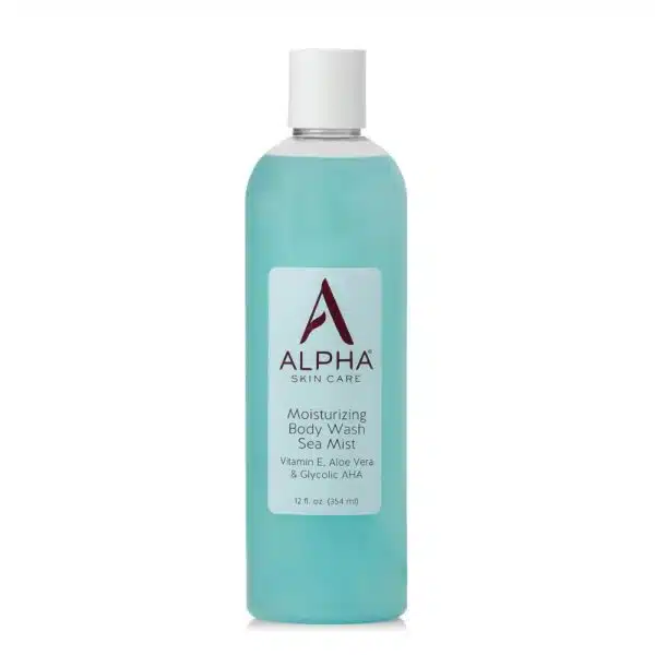 Clear white-background image of a 12 fl oz bottle labeled “Alpha Skin Care Moisturizing Body Wash – Sea Mist.” The burgundy Alpha “A” logo sits above product claims: 10 % glycolic AHA, Vitamin E & Aloe Vera. Aqua wave graphic suggests its refreshing, ocean-inspired scent.
