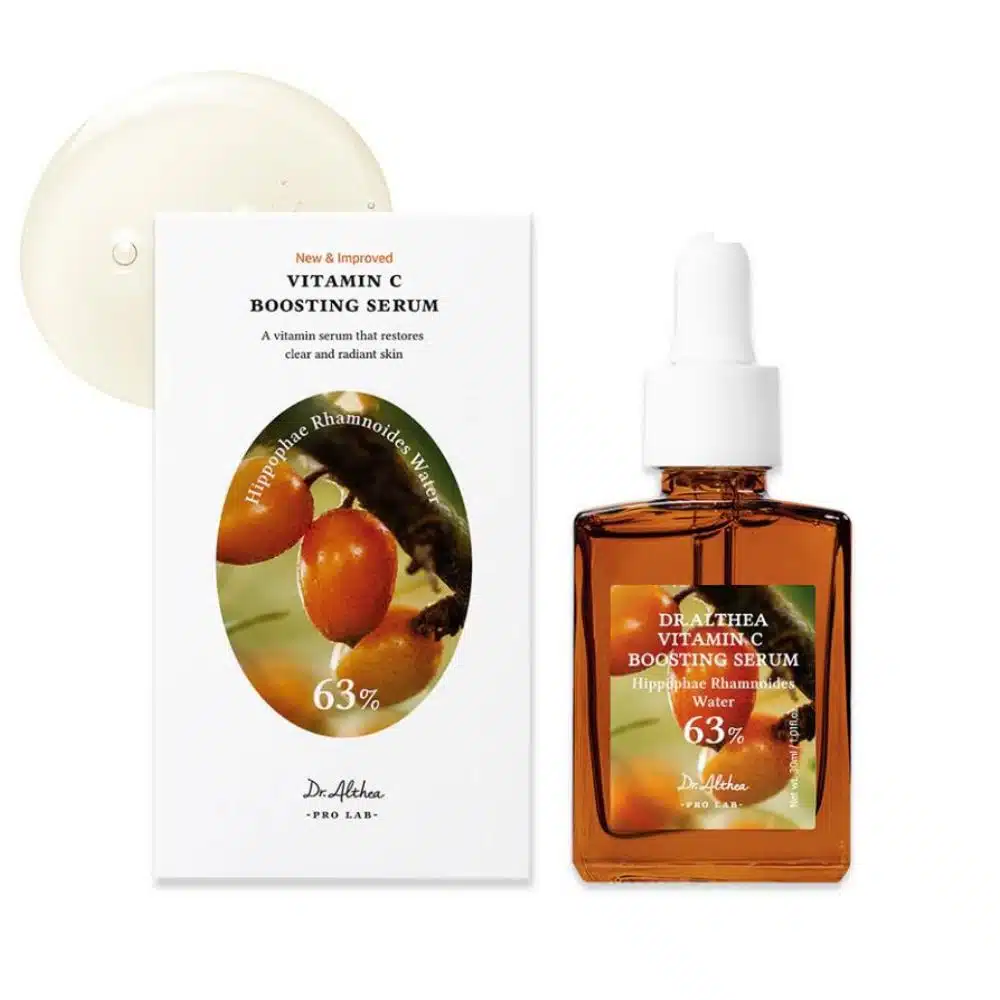 Clear 30 ml glass dropper bottle of Dr. Althea Vitamin C Boosting Serum standing upright on a white background; minimalist beige label with gold typography reads “Vitamin C Boosting Serum”, dropper cap slightly tilted, reflecting light to highlight the lightweight, translucent formula inside.