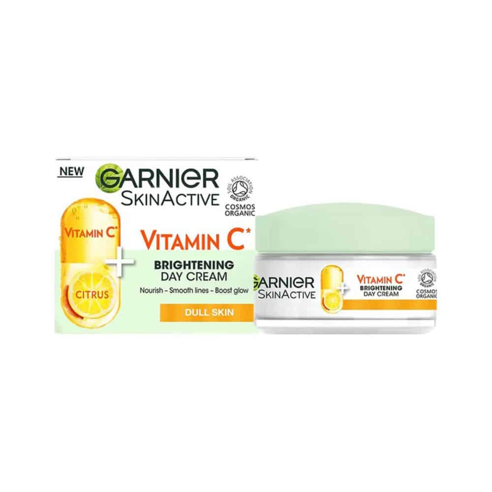 Front-facing 50 ml glass jar of Garnier Vitamin C Brightening Day Cream with yellow citrus accents on a clean white background, lid closed, Ghana retail version.