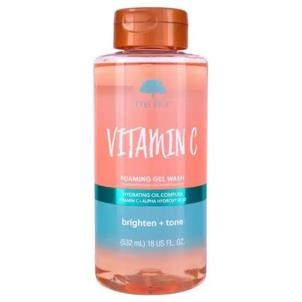 Clear bottle of Tree Hut Vitamin C Foaming Gel Wash (18 fl oz) standing upright on a white background; label features orange-yellow accents and citrus imagery, showcasing the brightening, vitamin C-infused body wash for radiant, hydrated skin.