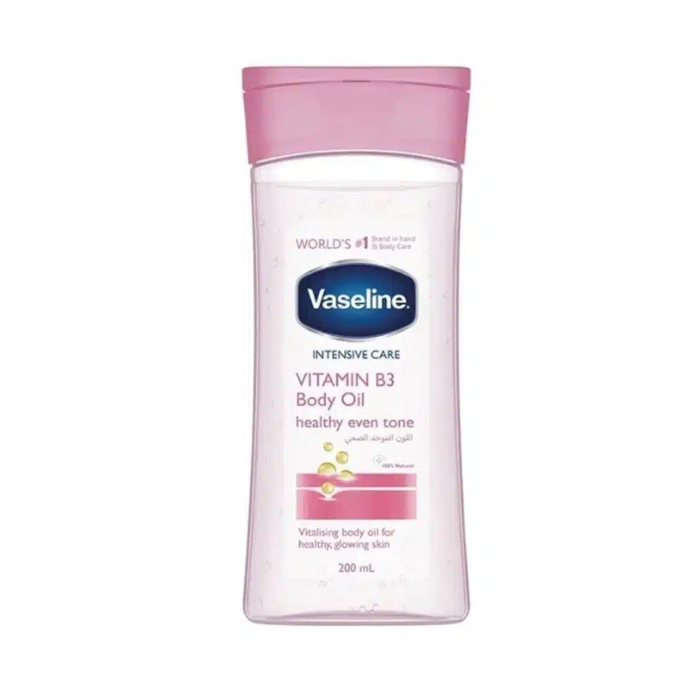 200 ml clear bottle of Vaseline Intensive Care Vitamin B3 Body Oil on a white background, showing lightweight golden oil and blue Vaseline logo, highlighting niacinamide brightening and 48-hour hydration benefits available at Pure Skincare Ghana.